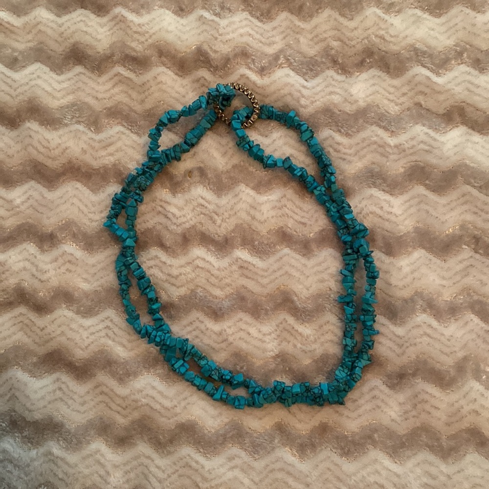Turquoise colored long beaded necklace. About 34 in long. See pics